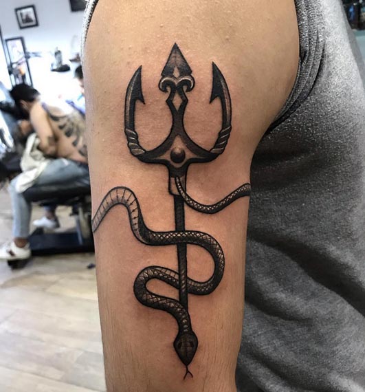 snake wrapping around trishul and bicep tattoo design male bicep